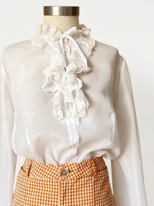 White ruffle blouse